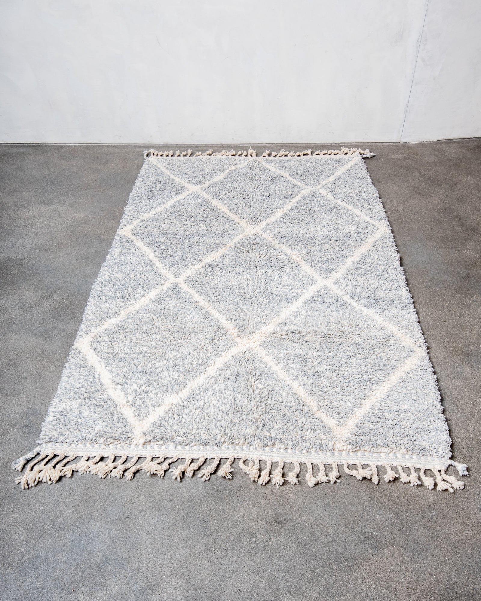Modern, designer, handcrafted Berber rug from Morocco. Beniourain carpet with beautiful colours and patterns and fluffy wool texture.